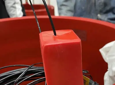 Fiber optic probes installed inside a dry-type transformer winding at an industrial facility
